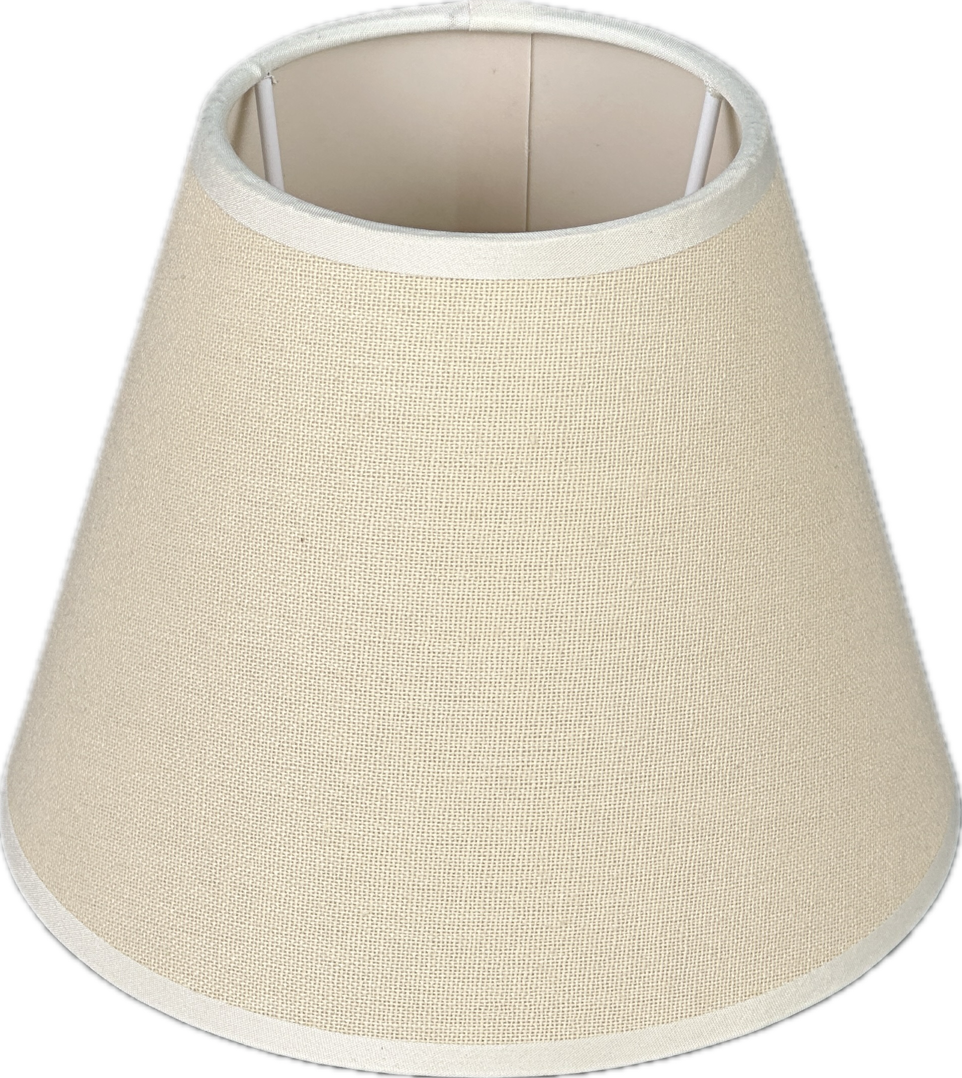 Bright bedroom with white bed, gold throw and open windows overlooking greenery.