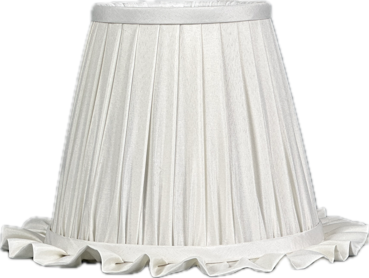 Dining corner with lamp, plates, linen and woven placemat.