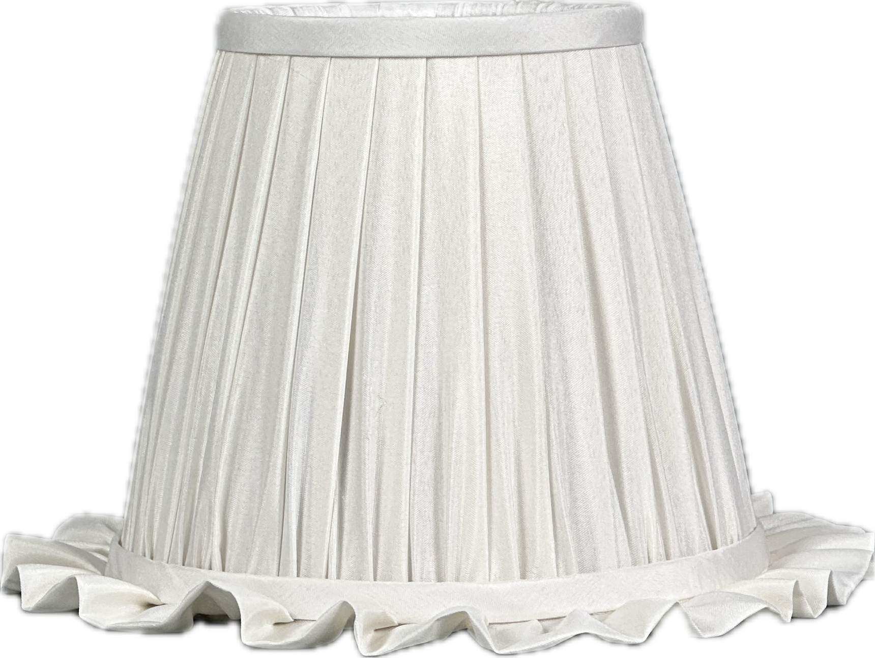 Dining corner with lamp, plates, linen and woven placemat.