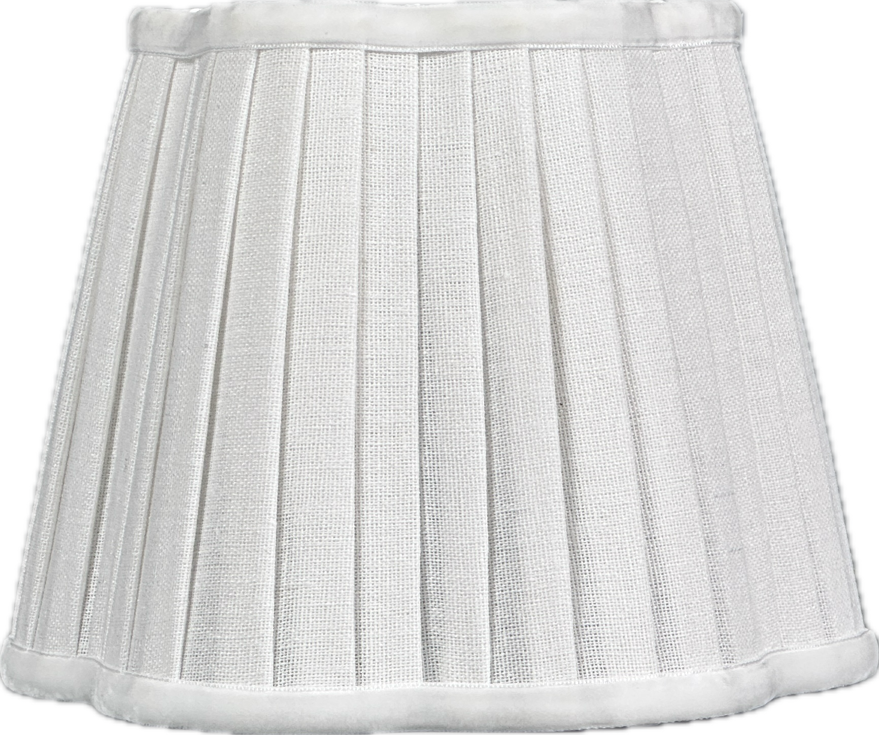 Modern side table with vase, brass lamp, books in light-filled room.