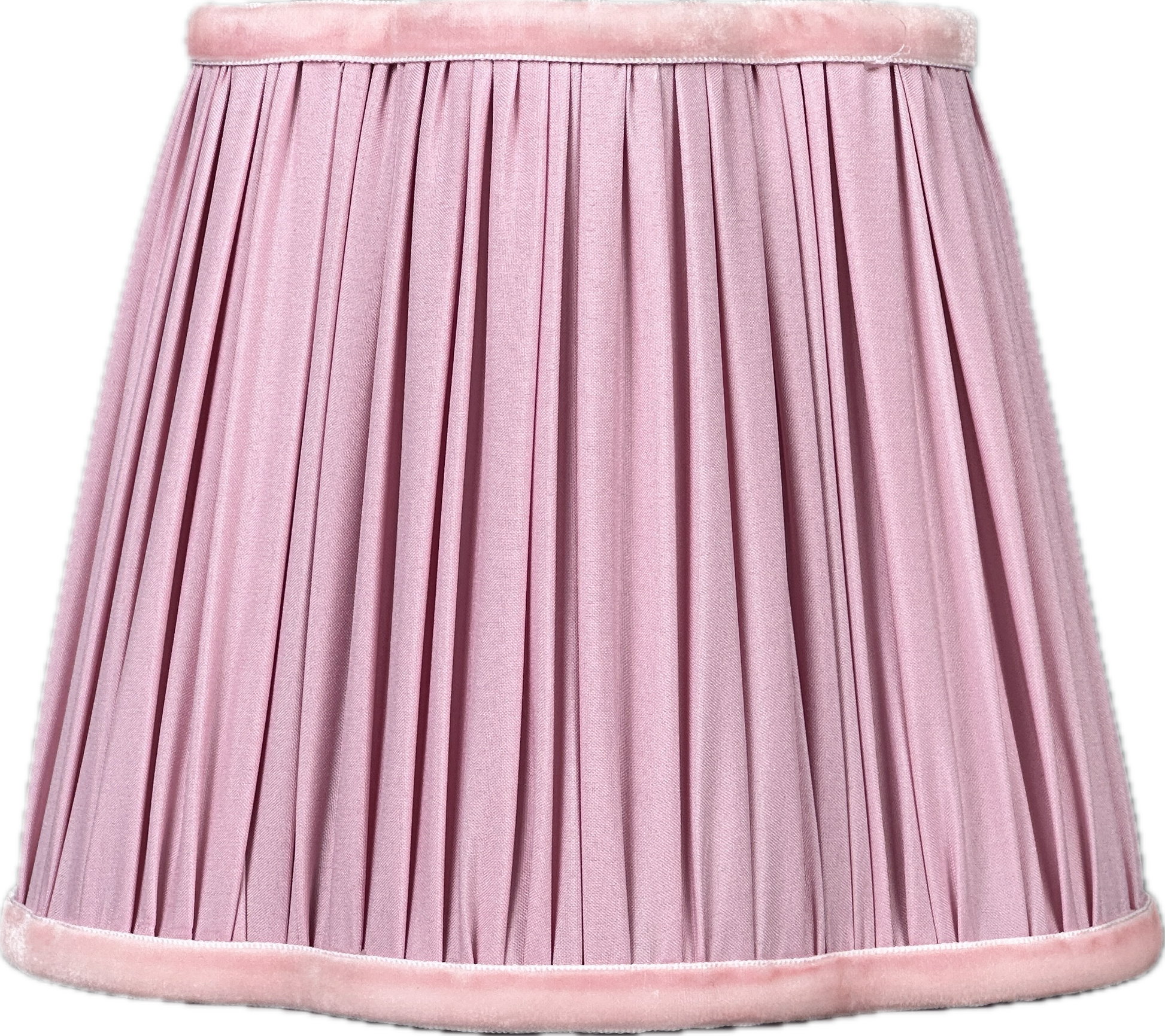 Kitchen nook with lamp, pitcher and patterned tile backsplash.