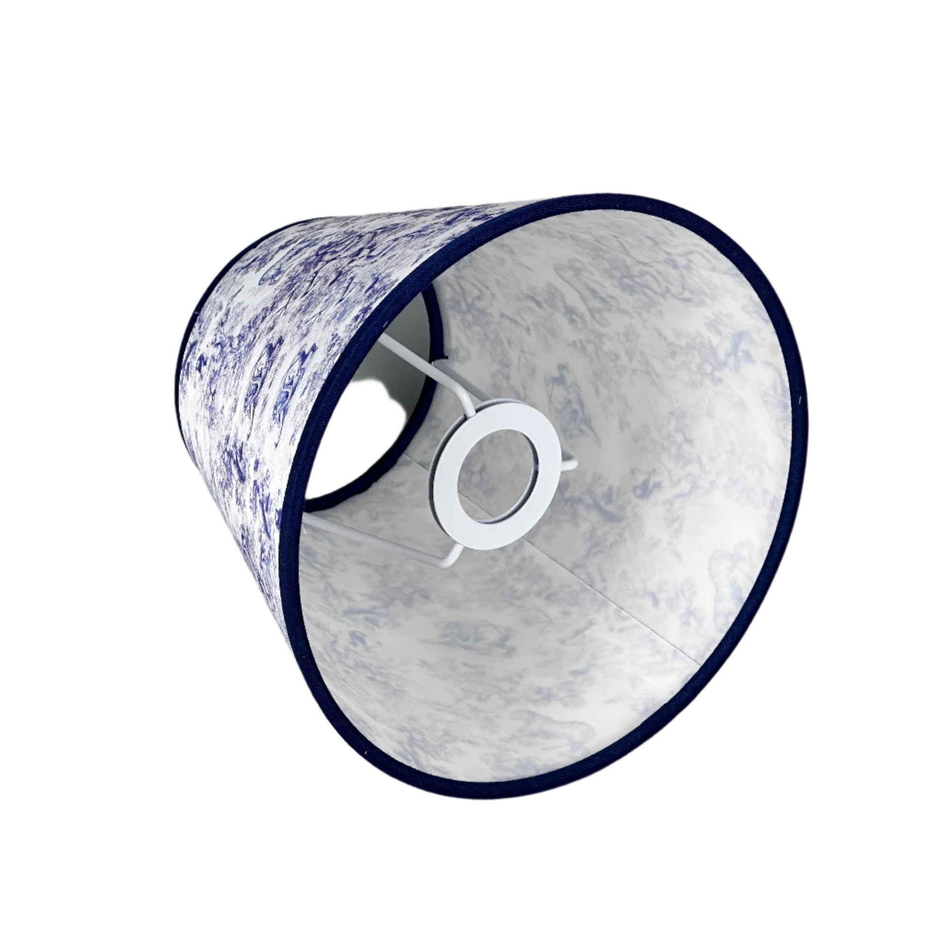 Light-filled room corner with brass lamp on side table and decor.