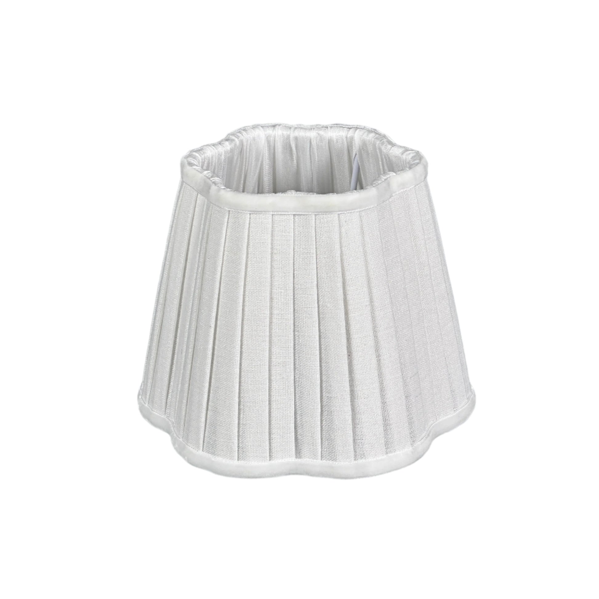 Daylight console scene with brass lamp and curated accessories.