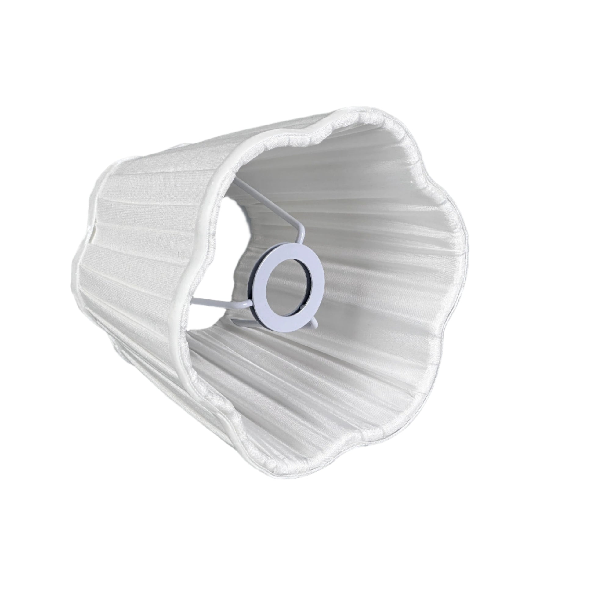 Styled side table with lamp, open book and neutral decor.