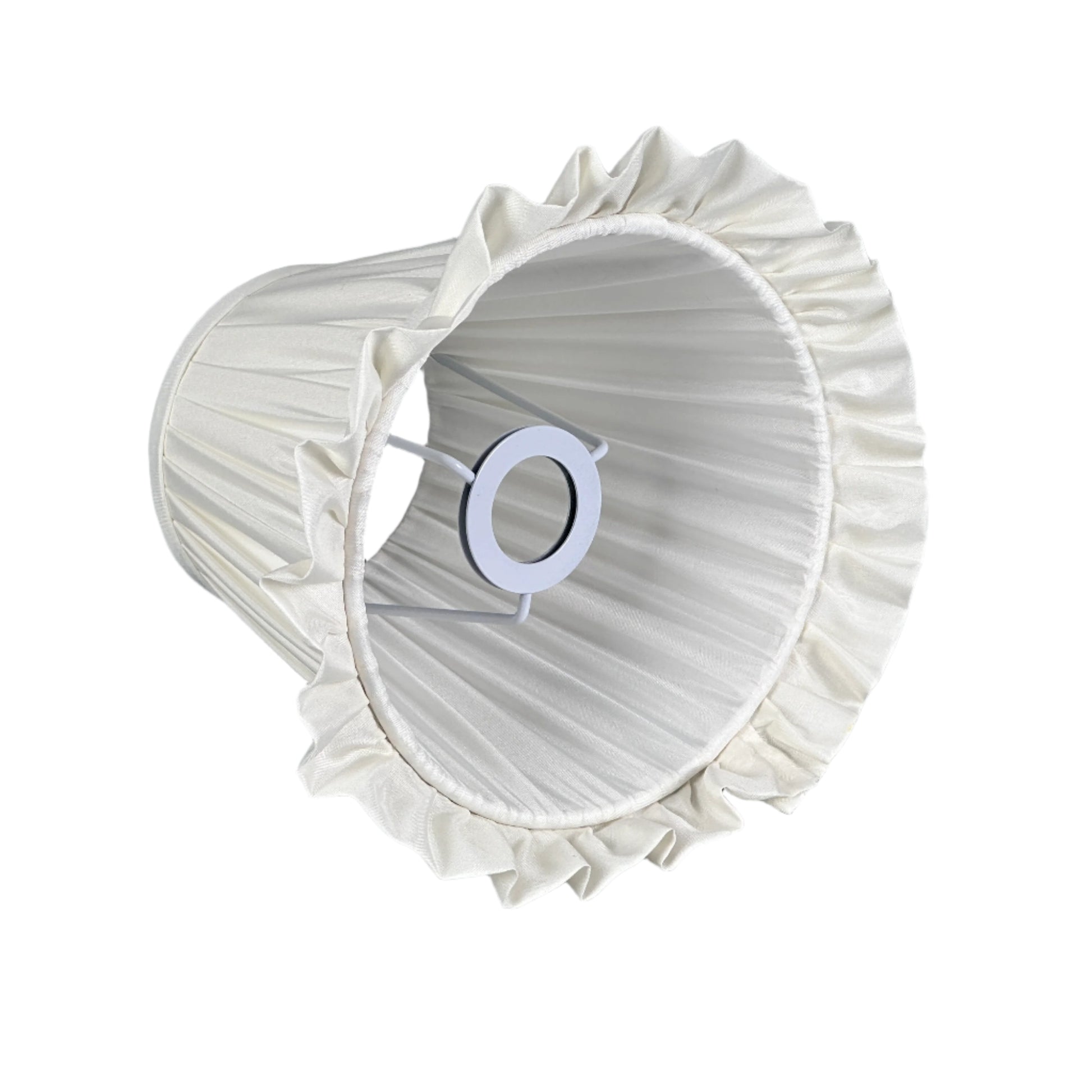 Bright side table scene with lamp, books, and minimalist styling.