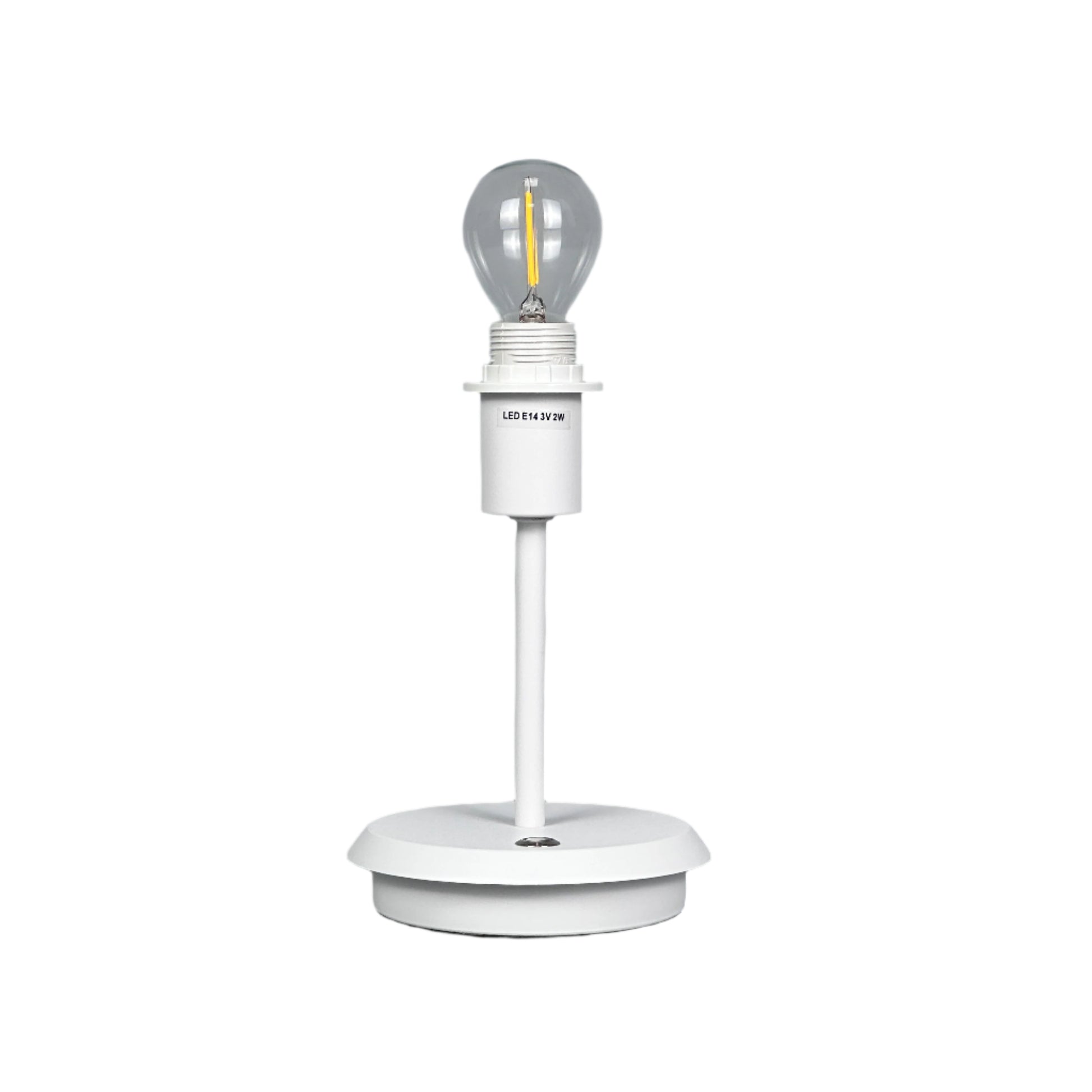 Neutral styled room with brass lamp, vase and textured textiles.